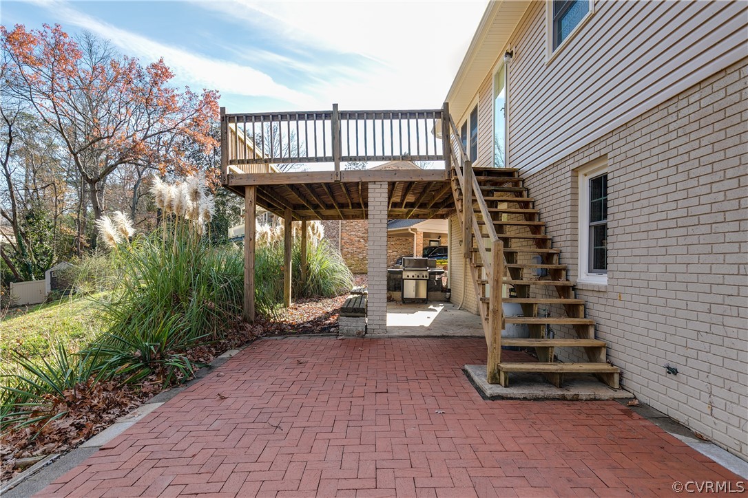 13007 Buckland Road Chester, VA 23831 - Photo 42 of 44 a view of a patio with wooden stairs next to a yard