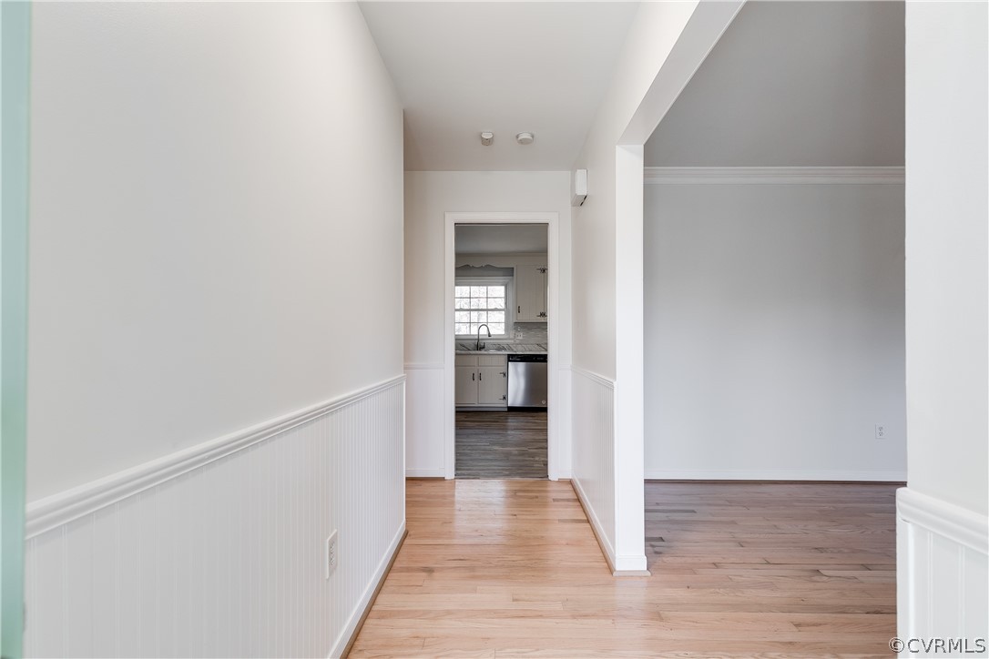 13007 Buckland Road Chester, VA 23831 - Photo 7 of 44 a view of a hallway with wooden floor and a bathroom