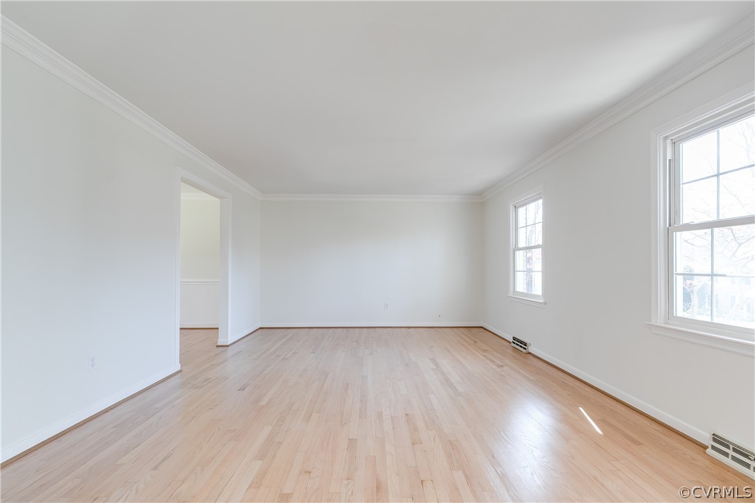 13007 Buckland Road Chester, VA 23831 - Photo 8 of 44 an empty room with wooden floor and windows