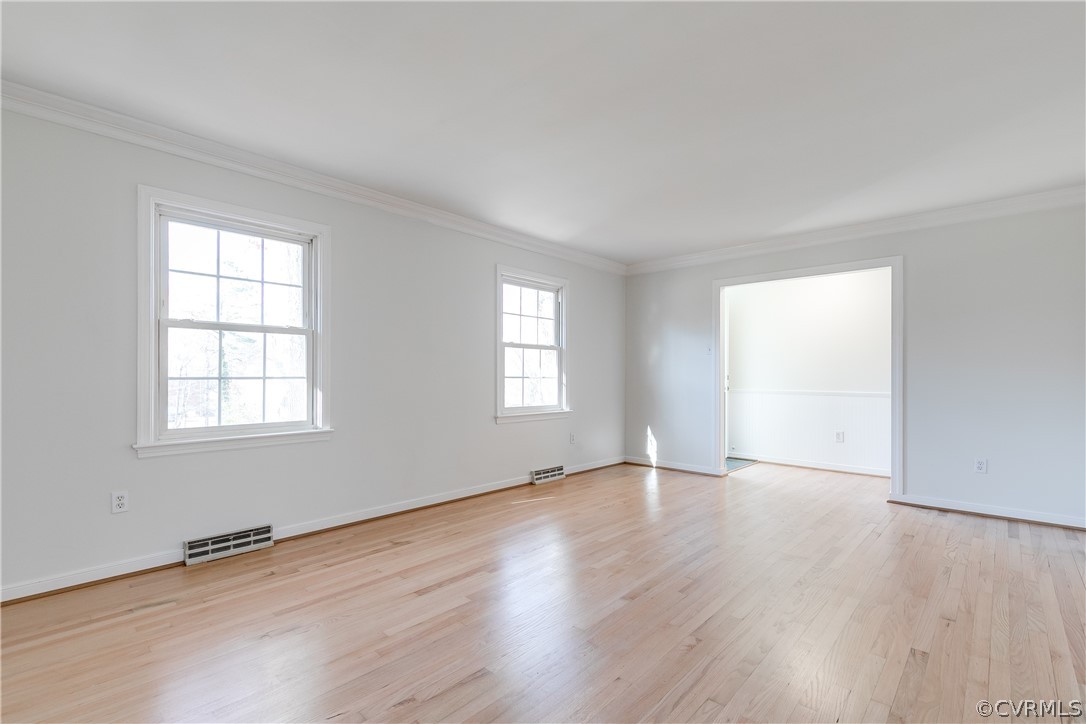 13007 Buckland Road Chester, VA 23831 - Photo 9 of 44 an empty room with wooden floor and windows