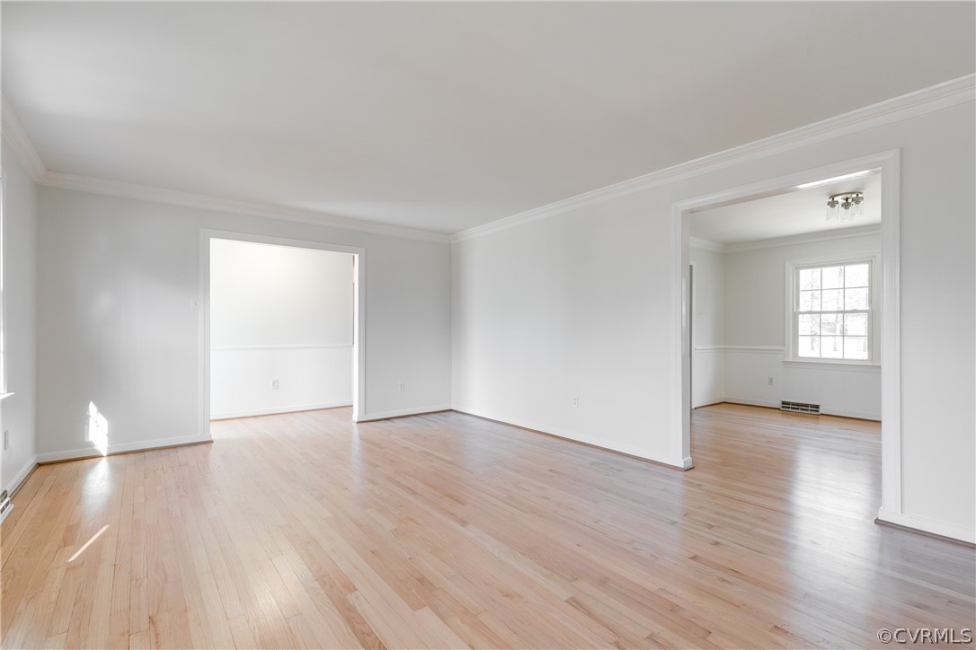 13007 Buckland Road Chester, VA 23831 - Photo 10 of 44 an empty room with wooden floor and windows