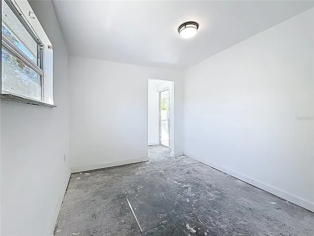 an empty room with windows