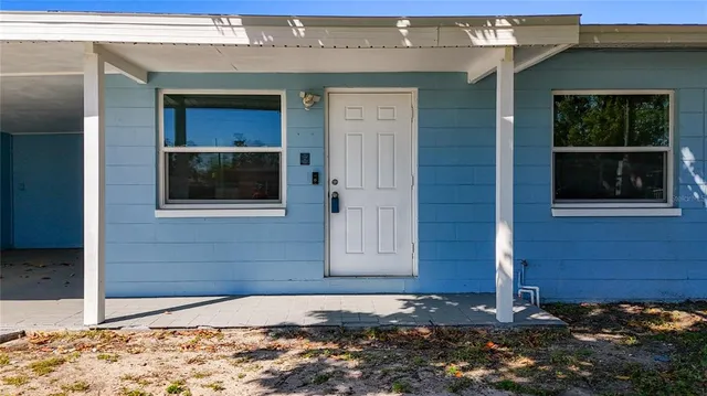 a wooden door in front of a house