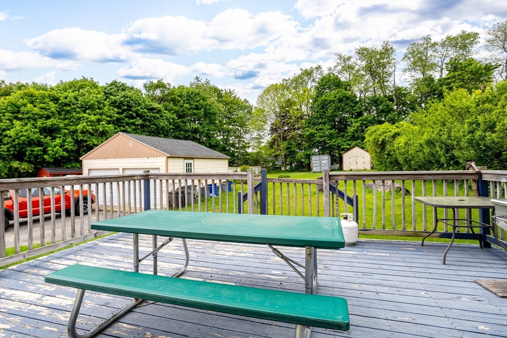 54 Charles Street Gardner, MA 01440 - Photo 34 of 40 a view of house with deck and outdoor seating