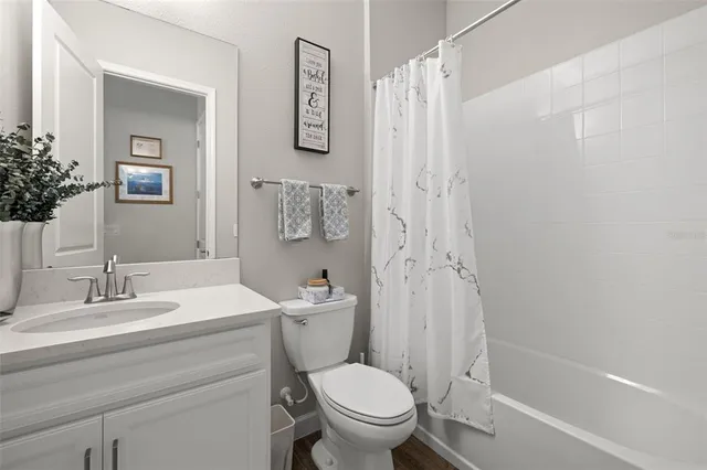 a bathroom with a double vanity sink and mirror