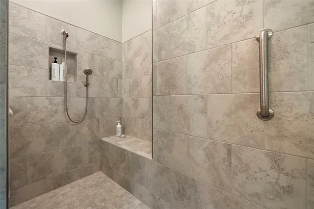 a kitchen with stainless steel appliances a sink stove and cabinets