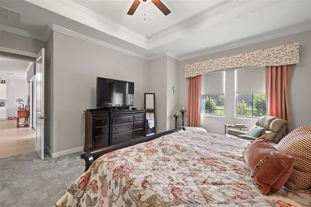 an aerial view of a residential houses with outdoor space and a lake view