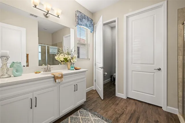 a bathroom with a shower and toilet