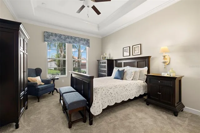 a view of a dining room with furniture a chandelier and wooden floor