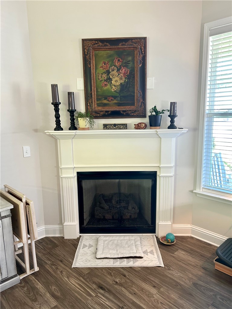 170 Capslock Trail Pendleton, SC 29670 - Photo 4 of 22 A classic fireplace with a detailed white mantel anchors this warm living space.