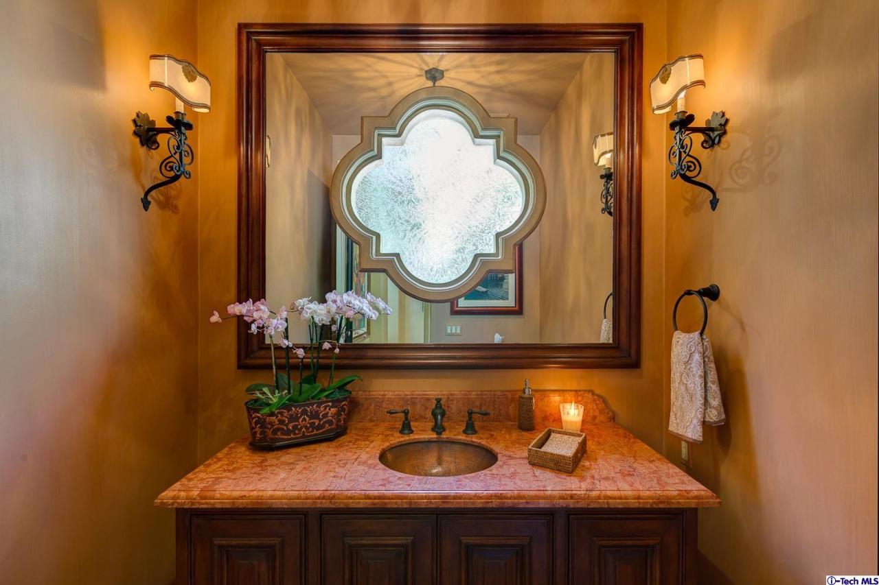 Undisclosed Address Pasadena, CA 91103 - Photo 19 of 80 a bathroom with a sink and a mirror