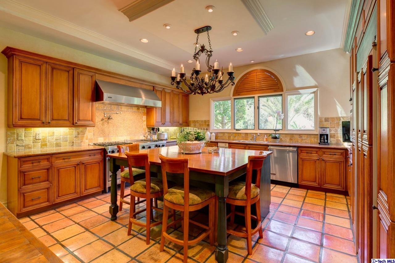 Undisclosed Address Pasadena, CA 91103 - Photo 25 of 80 a dining hall with stainless steel appliances kitchen island granite countertop a table chairs in it and a window