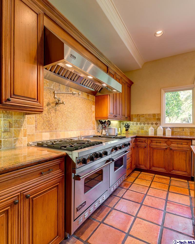 Undisclosed Address Pasadena, CA 91103 - Photo 28 of 80 a kitchen with stainless steel appliances granite countertop a stove and a sink