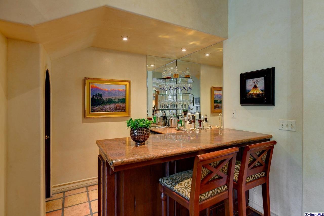 Undisclosed Address Pasadena, CA 91103 - Photo 32 of 80 a view of a dining room with furniture and wooden floor