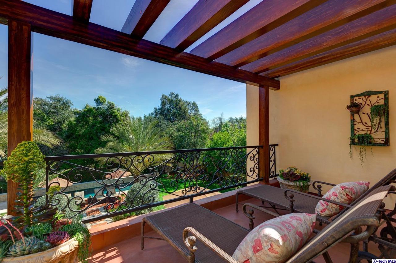 Undisclosed Address Pasadena, CA 91103 - Photo 43 of 80 a view of a balcony with couches and potted plants