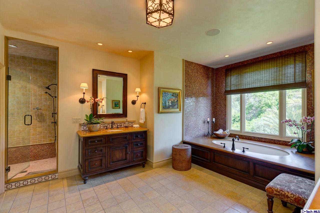 Undisclosed Address Pasadena, CA 91103 - Photo 45 of 80 a large bathroom with a large tub and sink