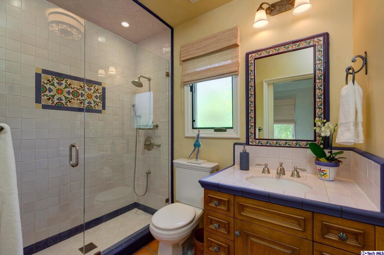 Undisclosed Address Pasadena, CA 91103 - Photo 56 of 80 a bathroom with a sink a toilet and shower