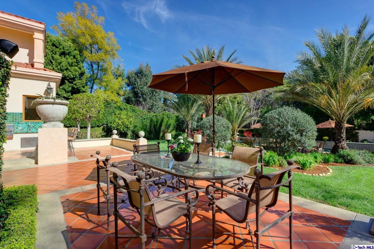 Undisclosed Address Pasadena, CA 91103 - Photo 60 of 80 an outdoor space with furniture and umbrella