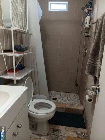 a bathroom with a toilet and a sink