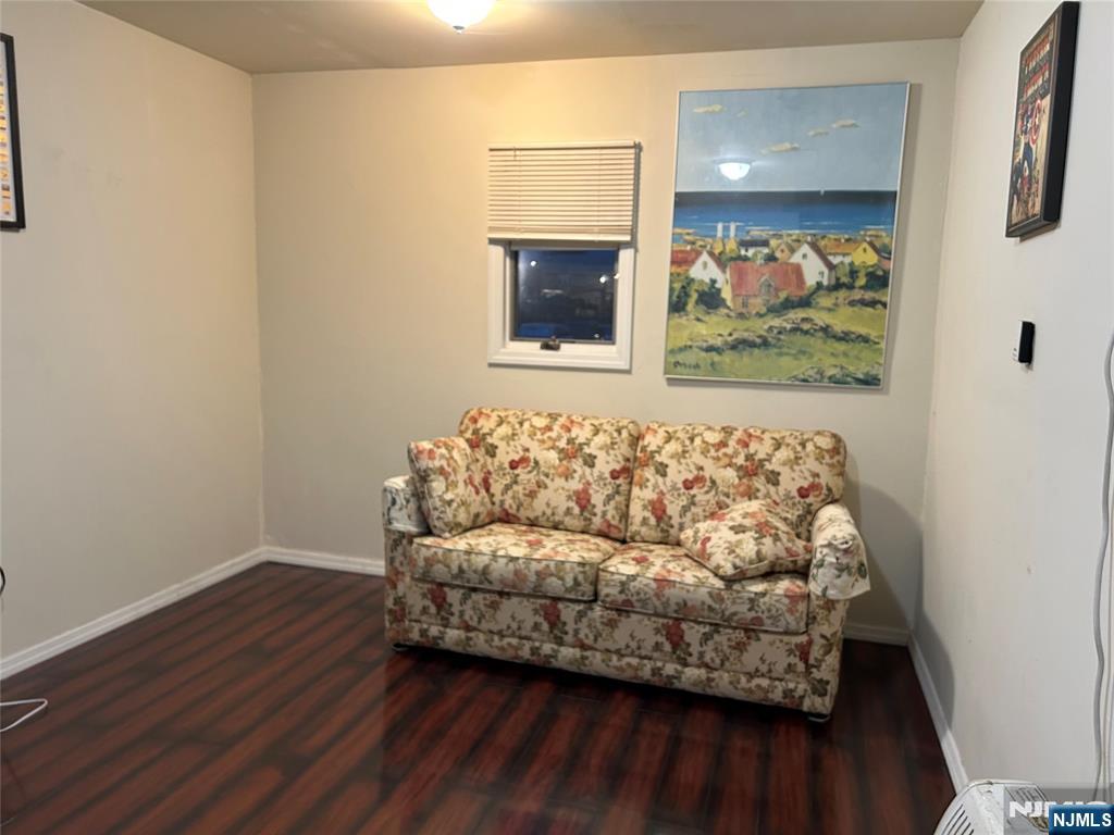 40 Poplar Street Lodi, NJ 07644 - Photo 3 of 16 a living room with furniture and a window