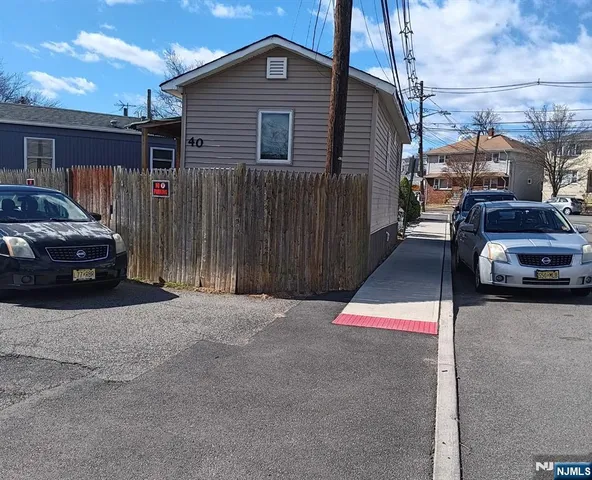 a view of a car park in front of house