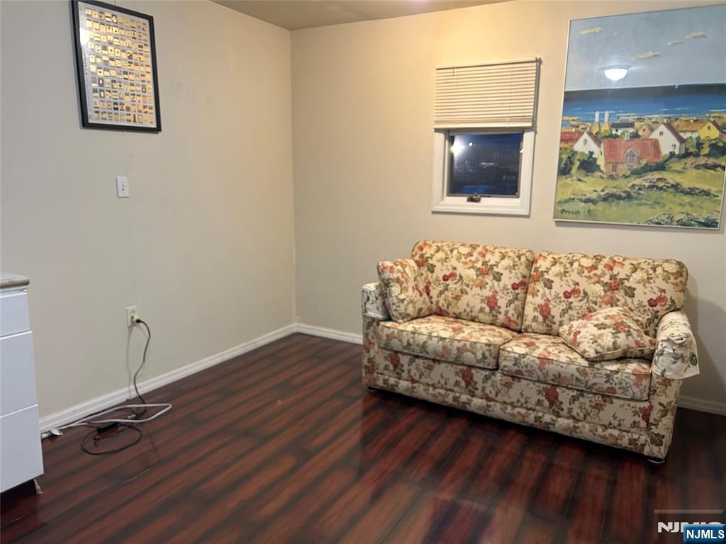 40 Poplar Street Lodi, NJ 07644 - Photo 9 of 16 a living room with a couch and painting on the wall