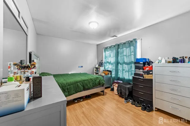 a bed room with a bed and a window