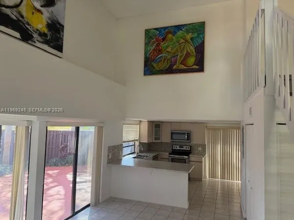 a kitchen with stainless steel appliances a stove and a refrigerator
