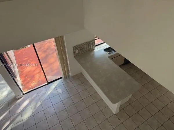 a view of a living room and entryway