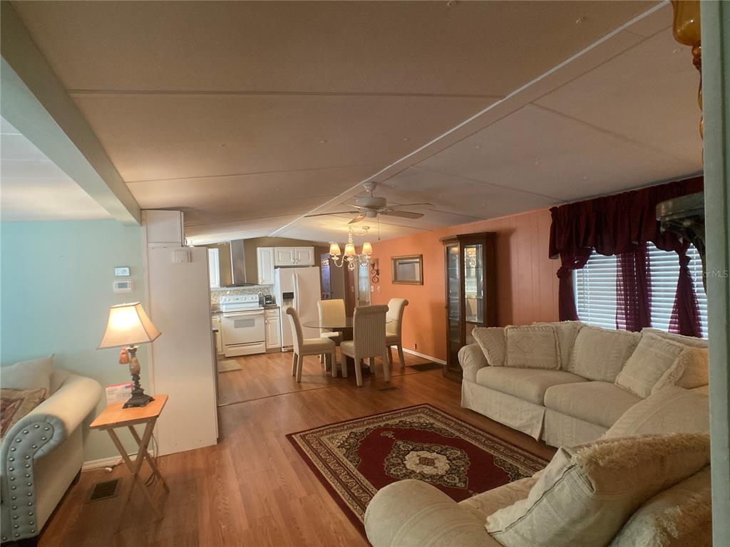 1710 7th Street Southwest, Unit 44 Ruskin, FL 33570 - Photo 12 of 34 a living room with furniture and wooden floor