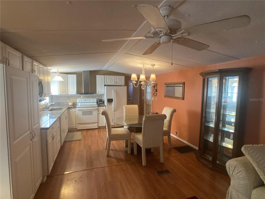 1710 7th Street Southwest, Unit 44 Ruskin, FL 33570 - Photo 13 of 34 a dining room with furniture and window