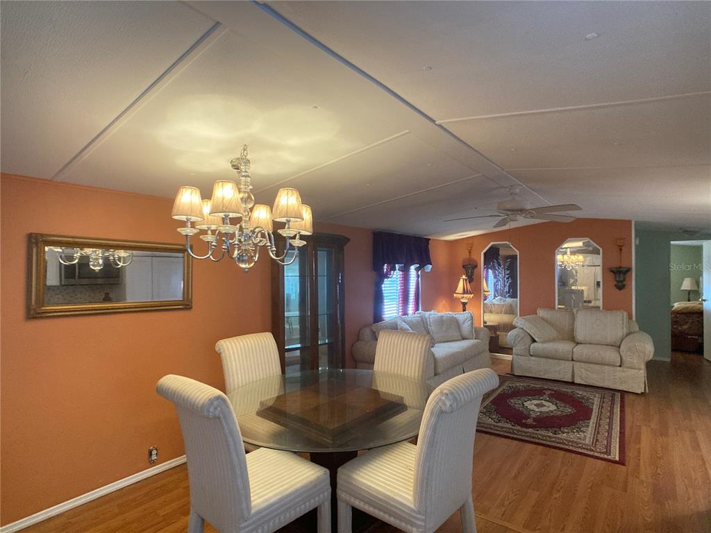1710 7th Street Southwest, Unit 44 Ruskin, FL 33570 - Photo 18 of 34 a view of a dining room with furniture and chandelier