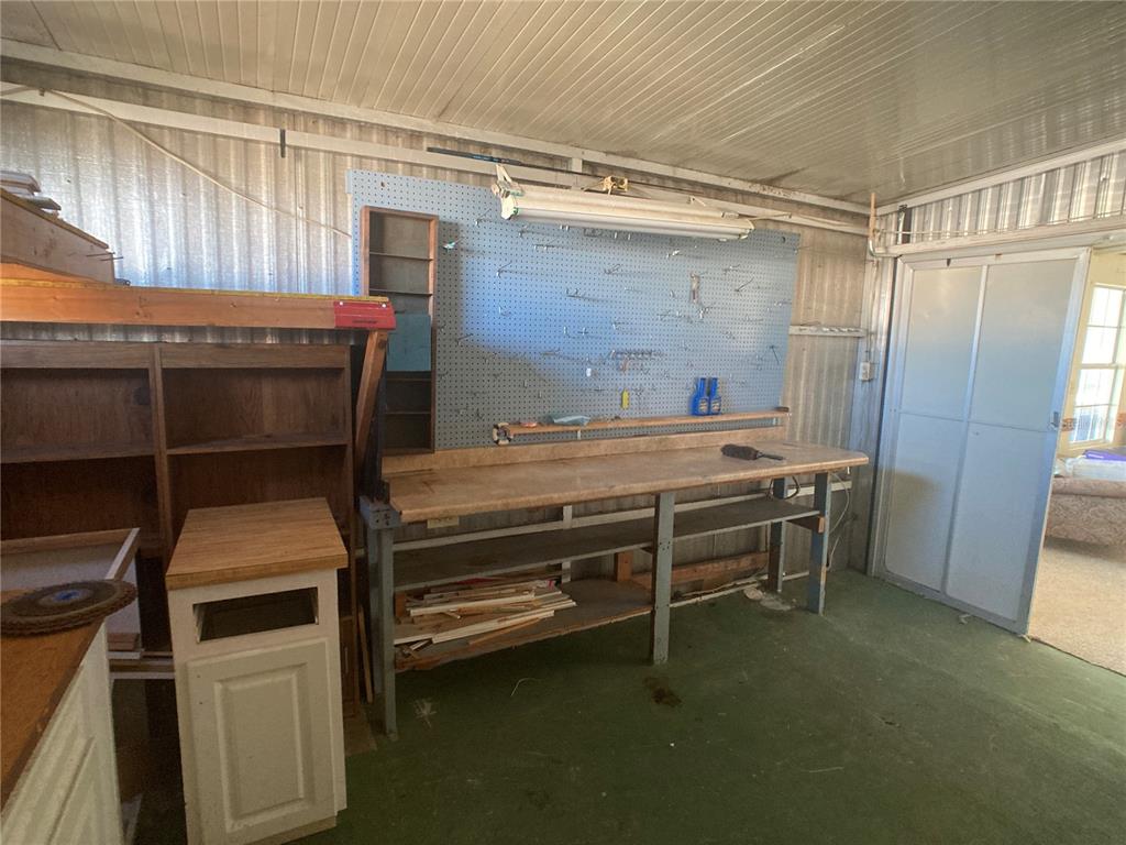 1710 7th Street Southwest, Unit 44 Ruskin, FL 33570 - Photo 29 of 34 a room with wooden furniture and windows