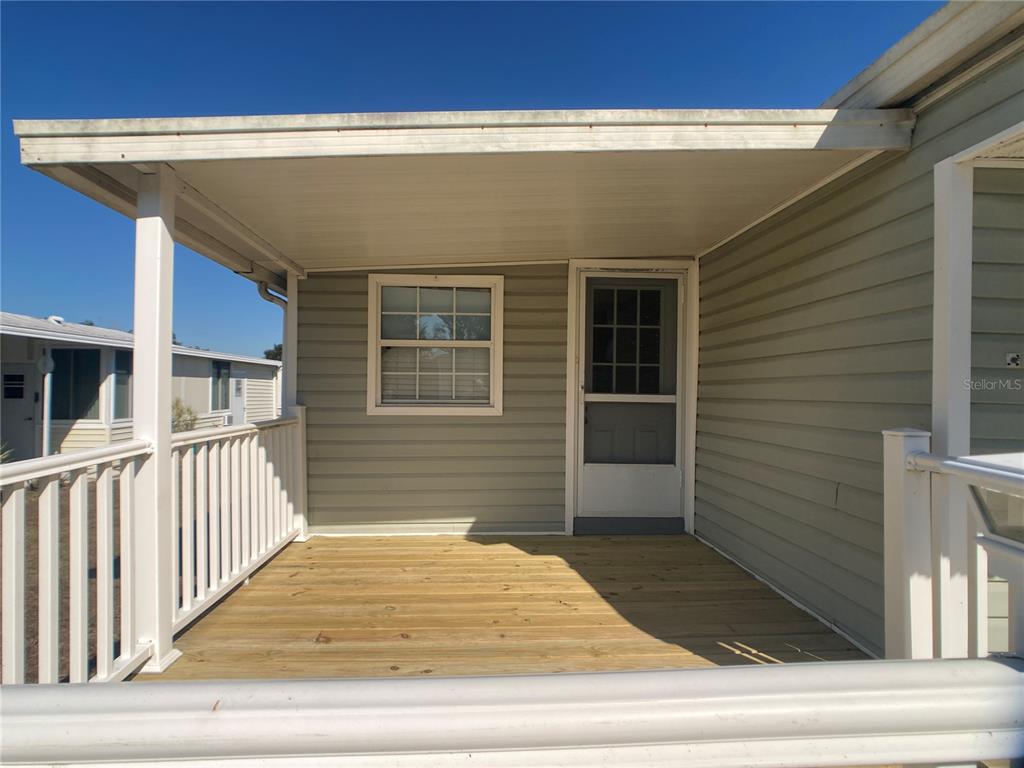 1710 7th Street Southwest, Unit 44 Ruskin, FL 33570 - Photo 3 of 34 a view of a house with a door and stairs