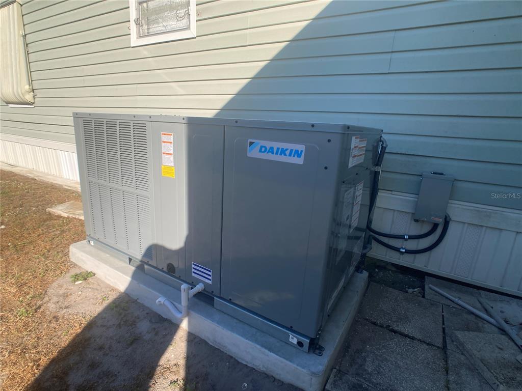 1710 7th Street Southwest, Unit 44 Ruskin, FL 33570 - Photo 33 of 34 a view of a room with wooden floor and chair