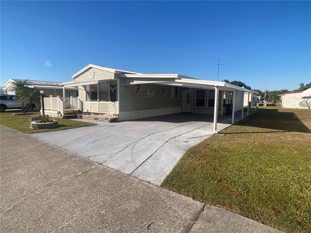 1710 7th Street Southwest, Unit 44 Ruskin, FL 33570 - Photo 34 of 34 a view of a house with backyard and roof