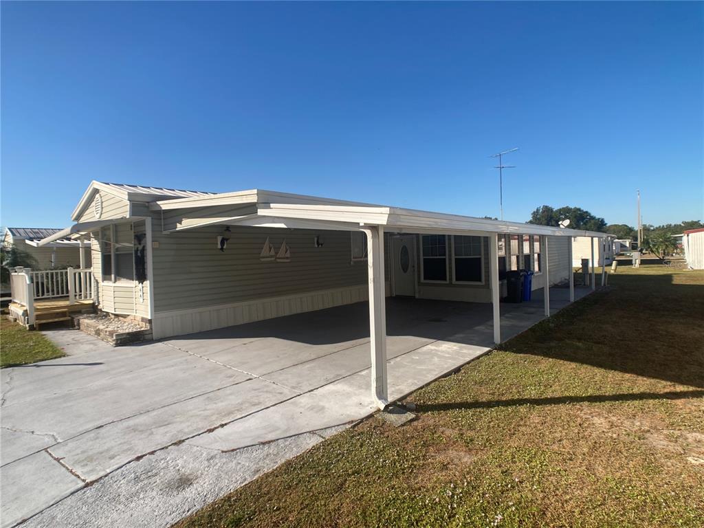 1710 7th Street Southwest, Unit 44 Ruskin, FL 33570 - Photo 4 of 34 a view of house with a outdoor space