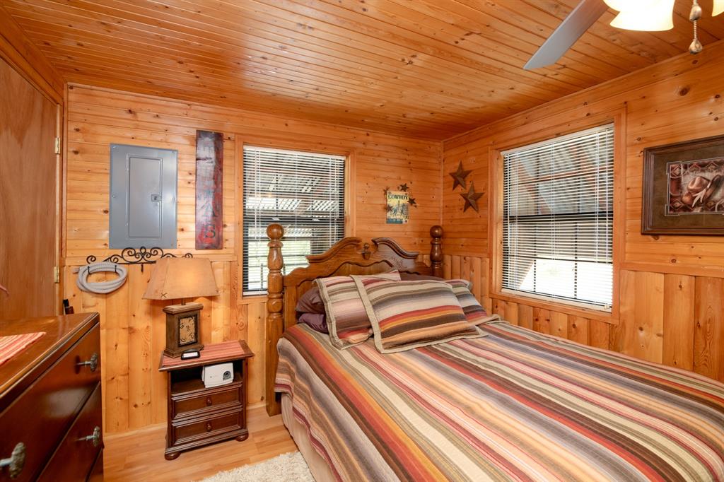 15055 County Road 306 Cisco, TX 76437 - Photo 16 of 40 a view of a bedroom with furniture and windows