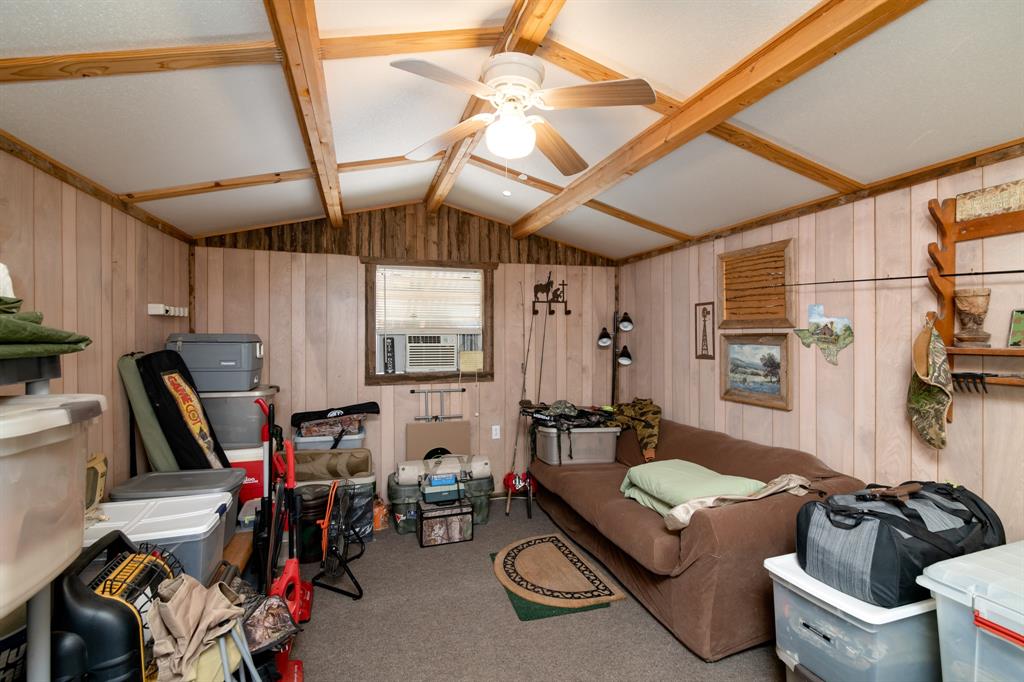 15055 County Road 306 Cisco, TX 76437 - Photo 22 of 40 a living room with furniture a flat screen tv and a window