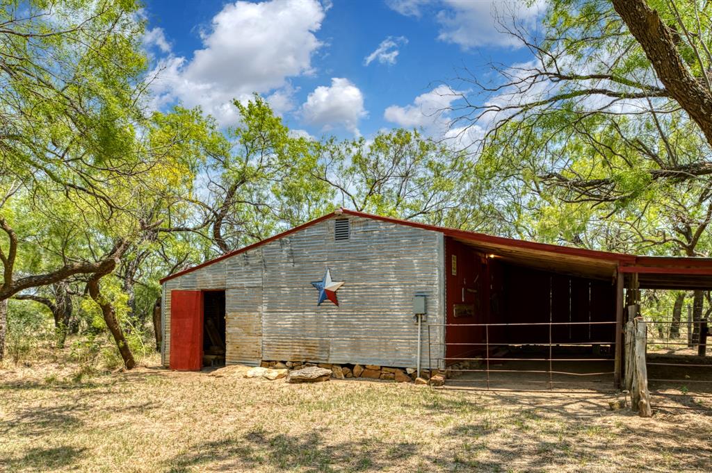 15055 County Road 306 Cisco, TX 76437 - Photo 24 of 40 a backyard of a house with lots of green space