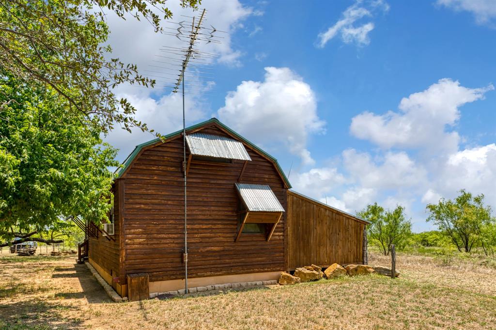 15055 County Road 306 Cisco, TX 76437 - Photo 6 of 40 a view of a house with a backyard