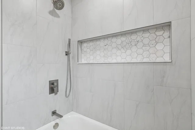 a bathroom with a shower curtain and a sink