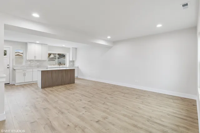 a view of kitchen with wooden floor