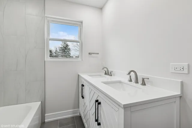 a bathroom with a sink and a bathtub
