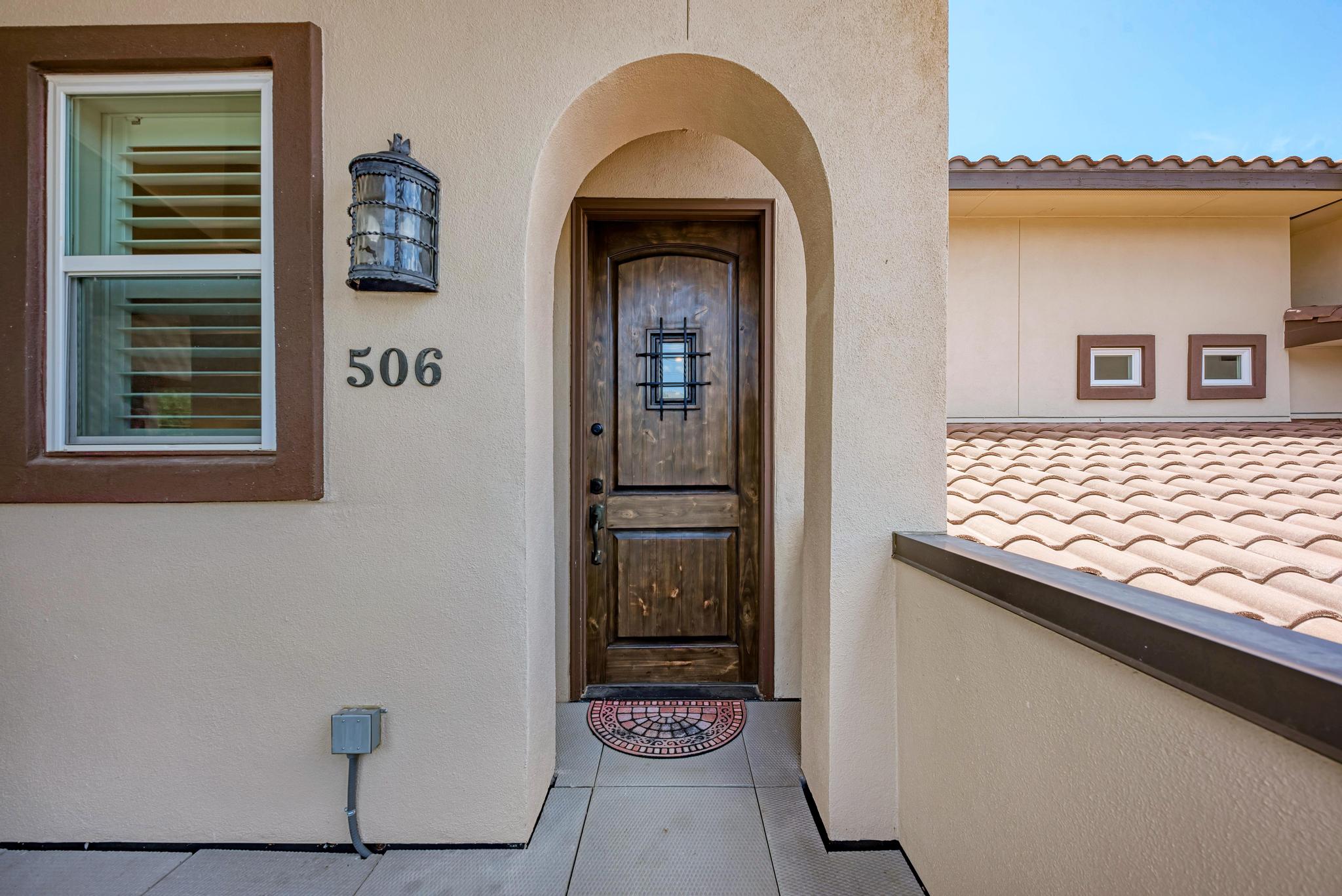 2601 North Quinlan Park Road, Unit 506 Austin, TX 78732 - Photo 5 of 39 A charming wooden entry door welcomes residents into this inviting abode.