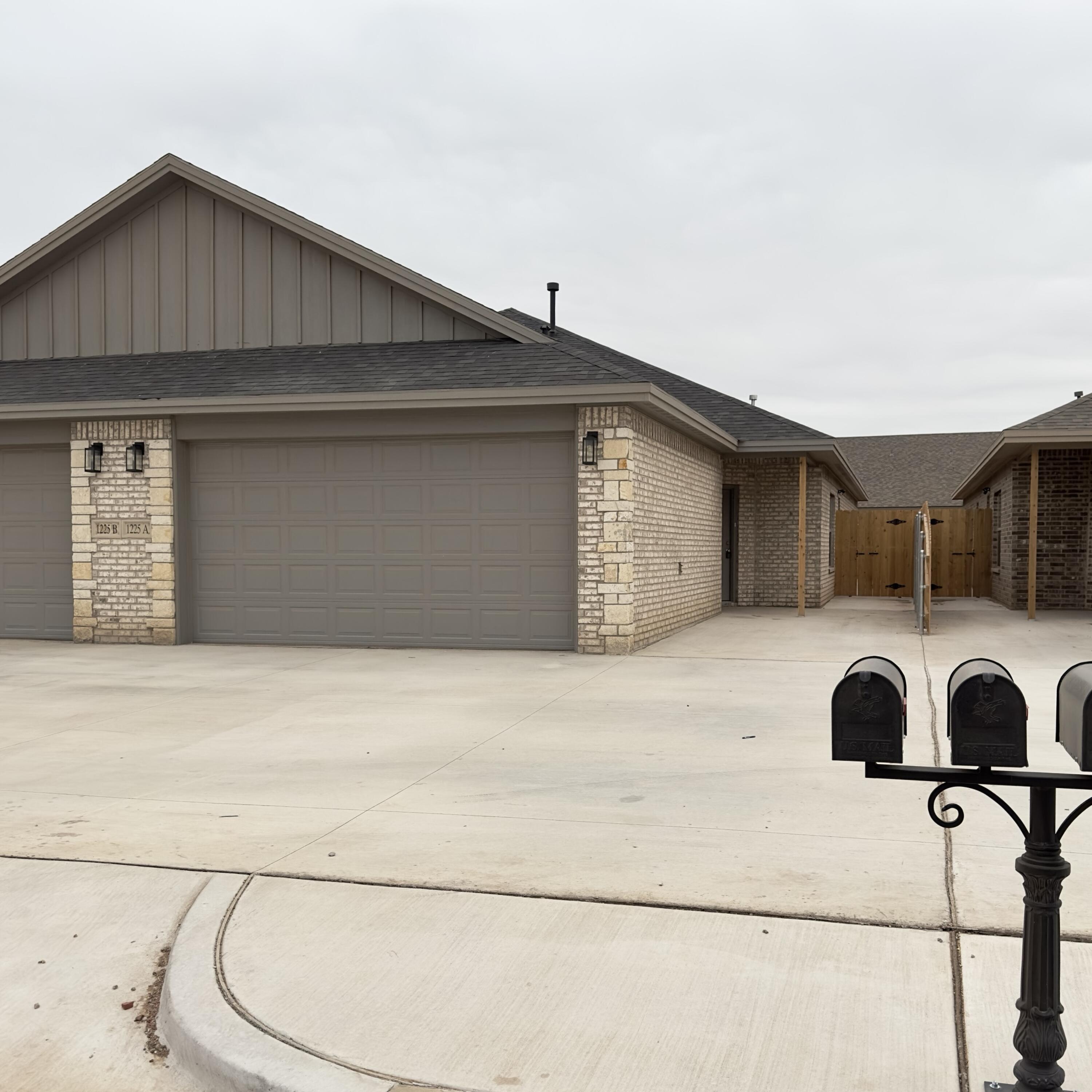 1225 Preston Trail, Unit A Wolfforth, TX 79382 - Photo 1 of 16 a house view with a outdoor space