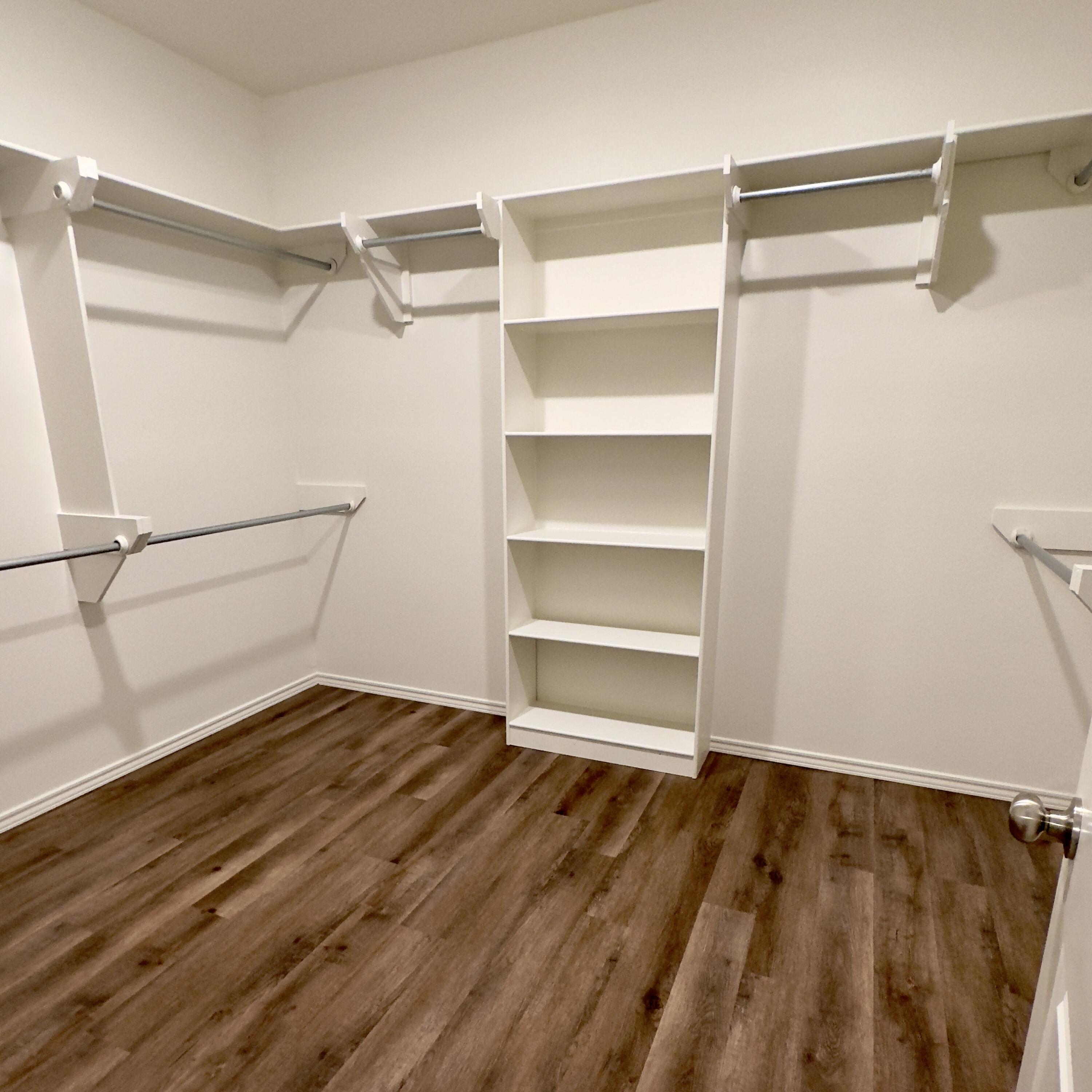 1225 Preston Trail, Unit A Wolfforth, TX 79382 - Photo 11 of 16 a view of an empty walk in closet