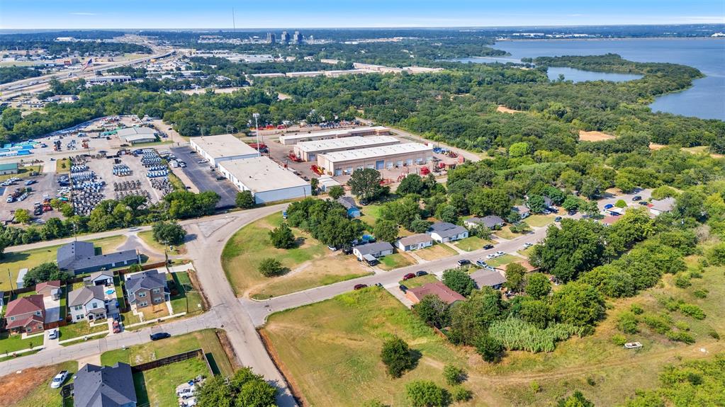 6004 Grayson Street Fort Worth, TX 76119 - Photo 11 of 13 an aerial view of residential houses with outdoor space and trees