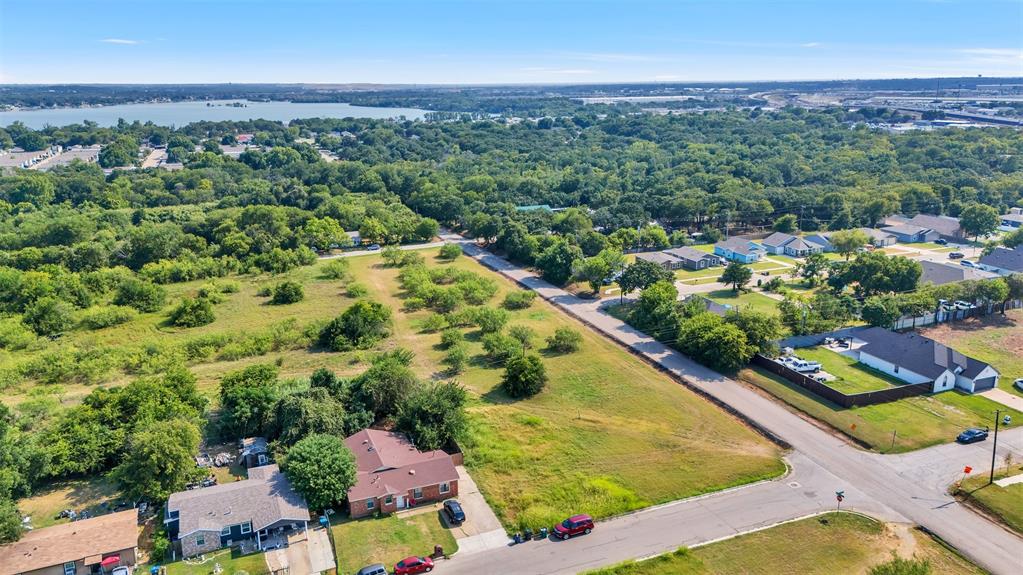 6004 Grayson Street Fort Worth, TX 76119 - Photo 8 of 13 an aerial view of residential houses with outdoor space
