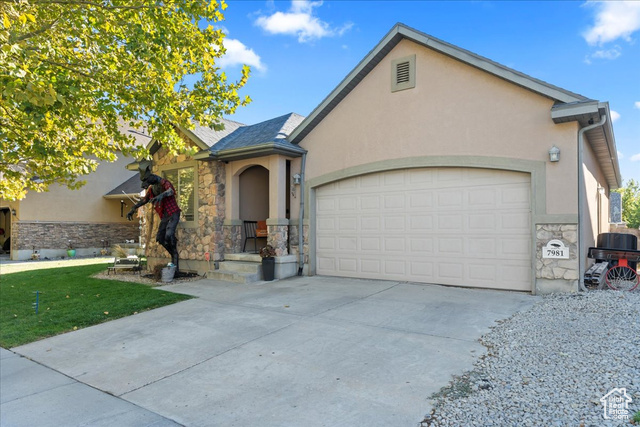 7981 Bury Road West Jordan, UT 84081 - Photo 1 of 1 View of front of home with a garage
